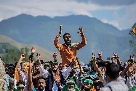 J-K Assembly polls: Supporters of Congress leader Rahul Gandhi shout slogans during an election rally at Dooru